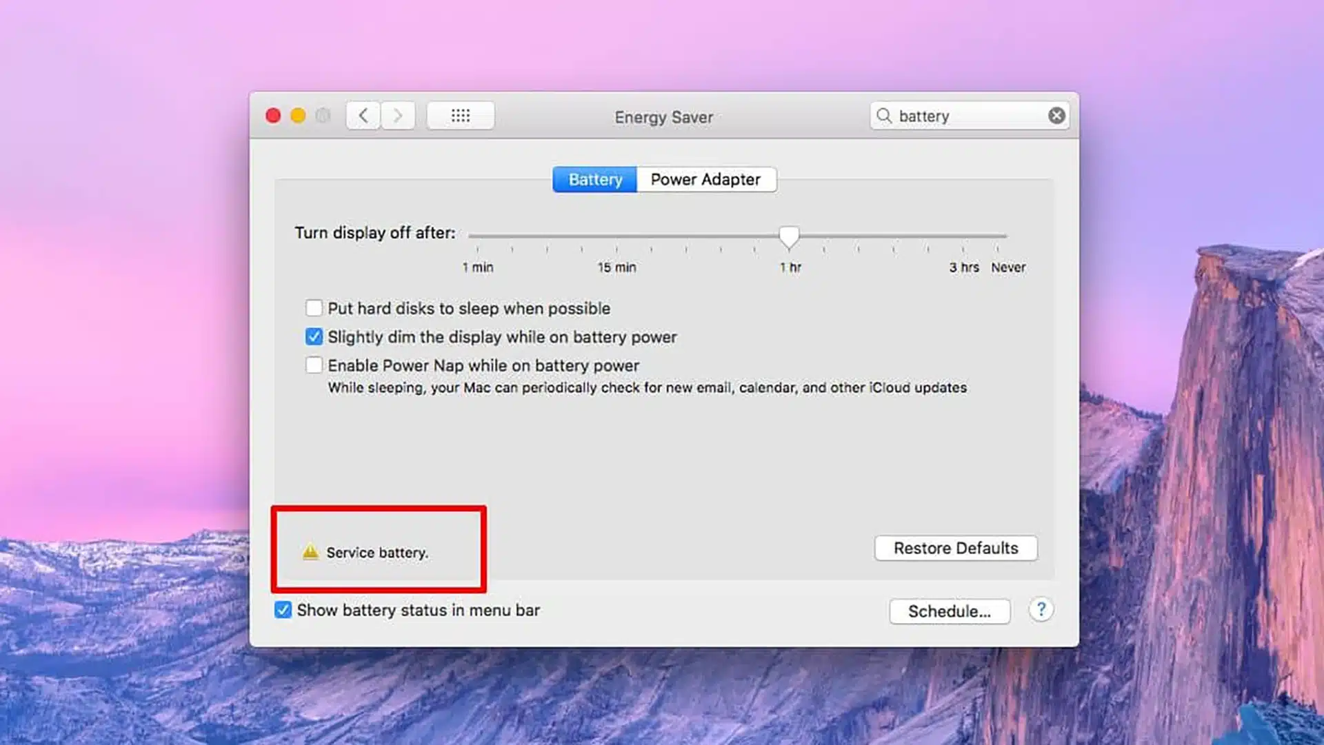 MacBook showing service battery warning in macOS energy saver settings indicating battery replacement needed